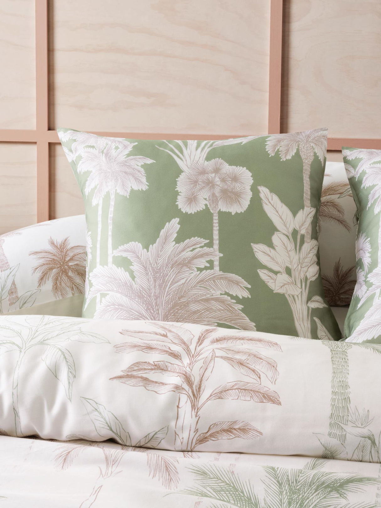 Lombok Duvet Cover Set by Savona featuring hand-drawn palm trees on a neutral background, perfect for a tropical bedroom retreat.