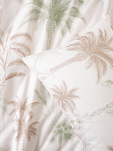 Lombok Duvet Cover Set by Savona featuring hand-drawn palm trees on smooth cotton for a tropical bedroom aesthetic.