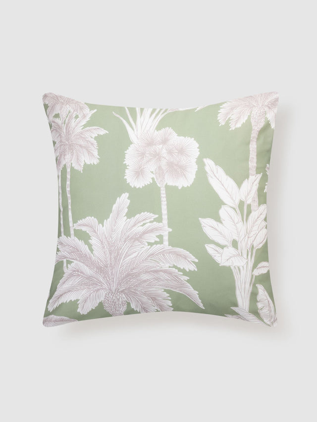 Lombok European Pillowcase by Savona features palm trees on sage green cotton, adding tropical elegance to any bedroom.