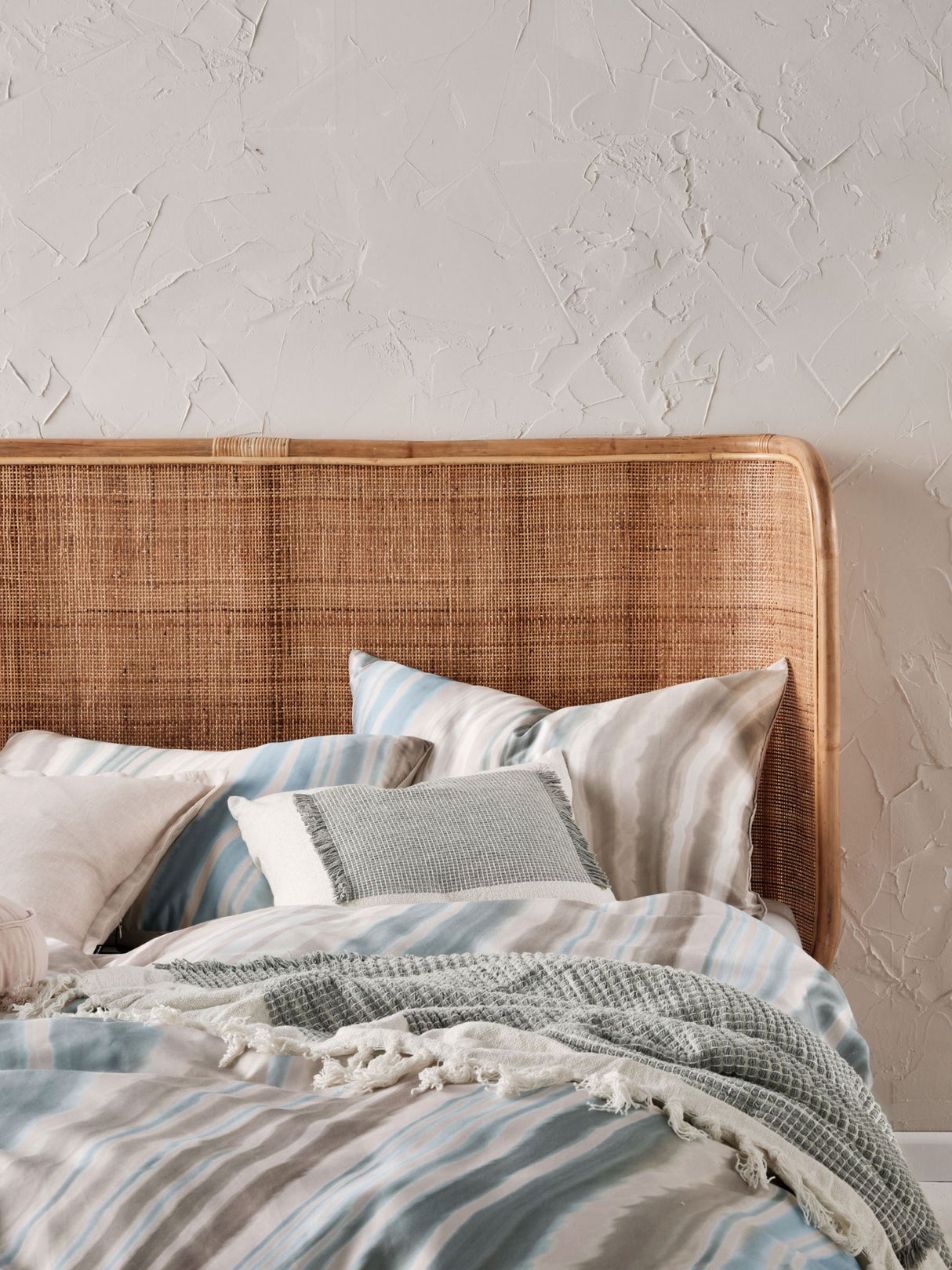 Super King duvet cover set featuring a marble-like design in blues and earthy tones, crafted from soft 100% cotton sateen.
