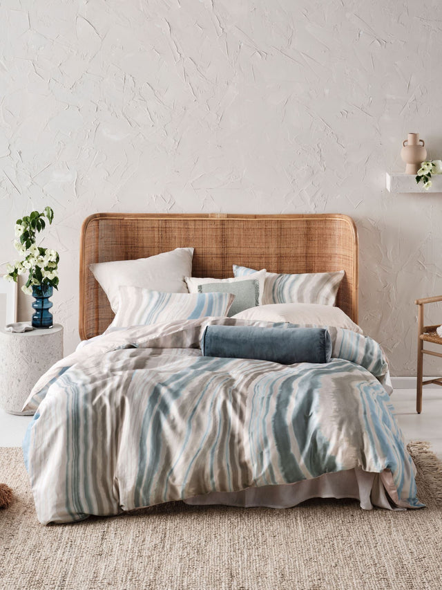 Super King duvet cover set with a marble-like natural design in blue and earthy tones, crafted from 100% cotton sateen.