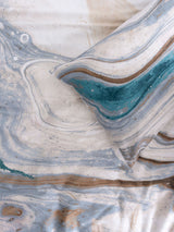 Super King duvet cover set in marble-inspired design with rich teal accents, made from 100% cotton sateen.