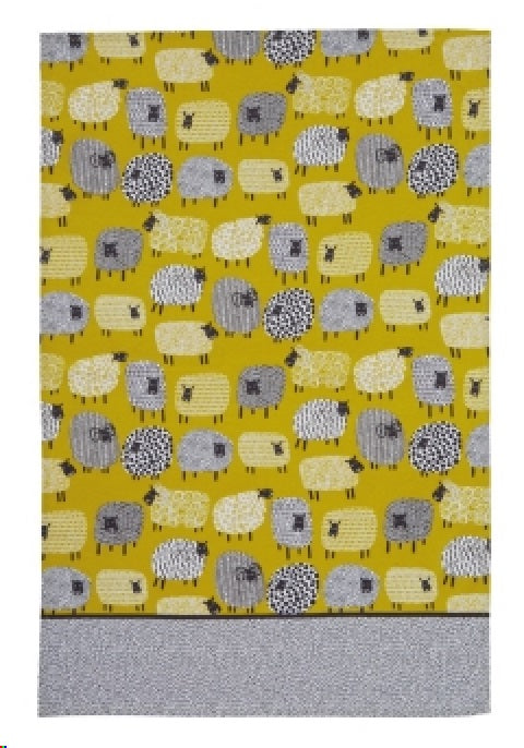 Cotton tea towel featuring a whimsical dotty sheep design, perfect for practical use and adding charm to your kitchen.