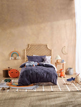 Single duvet cover set with tufted moons on a navy background, perfect for kids' bedrooms, made from soft 100% cotton.