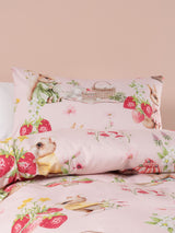 Double duvet cover set in blush featuring bunnies and strawberries, crafted from 100% cotton for cozy, playful bedding.