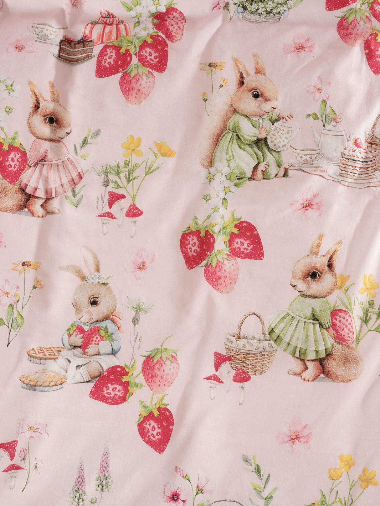 Whimsical double duvet cover set featuring bunnies and strawberries, crafted from soft 100% cotton in blush pink.