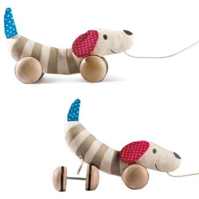 Interactive pull-along dog toy with nodding head and wagging tail, perfect for encouraging imaginative play in children 12 months and up.