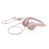 Logitech H390 USB headset in rose color, featuring noise-canceling mic, in-line controls, and comfort for audio calls and music.