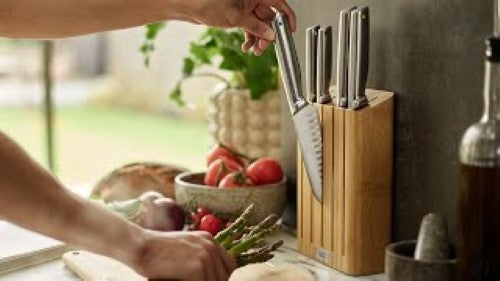 Elevate Steel Knives Bamboo Block set features 5 precision knives with ergonomic handles and stylish bamboo storage.