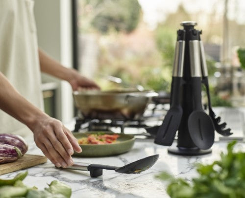 Elevate Silicone/Steel Carousel Set features 5 utensils with heat-resistant heads and a rotating stand for mess-free cooking.