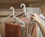 Orderly 5-Piece Anti-Tangle Hanger Set with oversized hooks and non-slip grips for an organized and sustainable wardrobe.