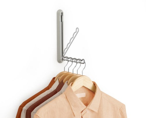 Orderly Retractable Hanging Rail by Joseph Joseph for temporary clothing storage, perfect for drying or ironing, folds away neatly.