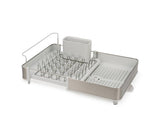 Extend Dish Rack by Joseph Joseph features adjustable sliding tray, non-scratch prongs, and drainage spout for efficient dish drying.