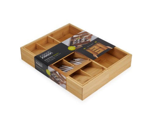 Bamboo drawer organiser with five compartments for cutlery and two for gadgets, expandable for custom fit in any kitchen drawer.