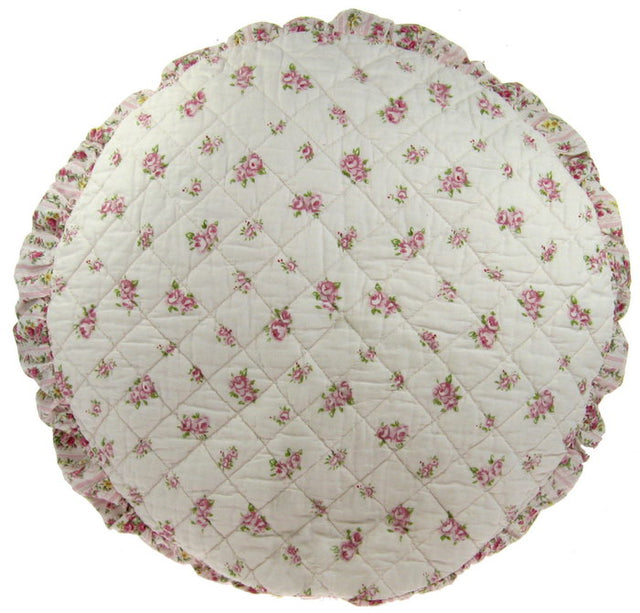 Soft pink quilted round cushion providing style and support for lounging, perfect for any home decor.