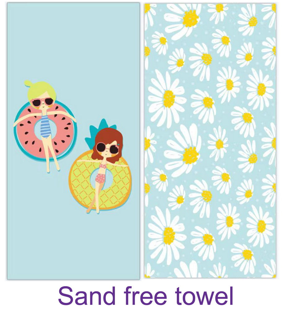 Two girls lounging on colorful donut floaties with a large, sand-free towel draped nearby, perfect for beach days.
