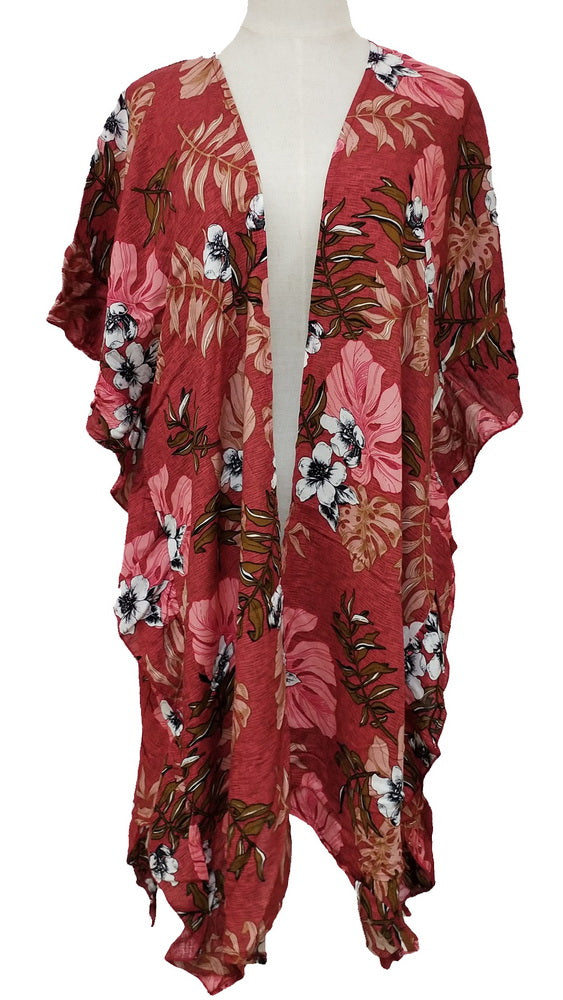 Cerise side ruffle cape made from 100% viscose, perfect for layering and adding vibrant style to any outfit.