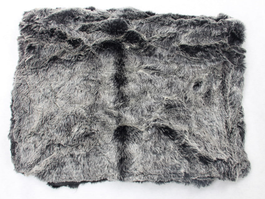 Luxurious black faux fur throw with white tips, featuring a soft micro mink back, perfect for adding elegance and warmth.