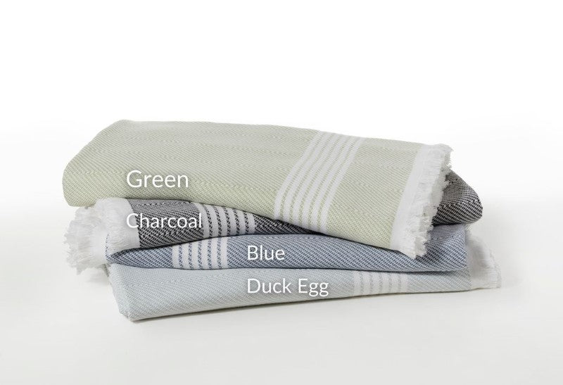 Duck egg beach blanket by BAKSANA, 200x200cm, featuring tassels and made from 100% cotton for outdoor comfort.