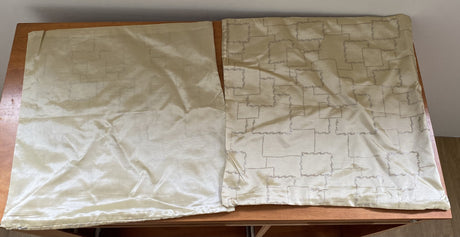 Elegant cream cushion covers with silver cube design, perfect for enhancing home decor. Set of 4 at clearance price.