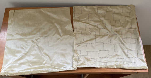 Elegant cream cushion covers with silver cube design, perfect for enhancing home decor. Set of 4 at clearance price.