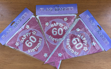 Two vibrant pink banners reading "Happy 60th Birthday," perfect for celebrating this milestone occasion in style.