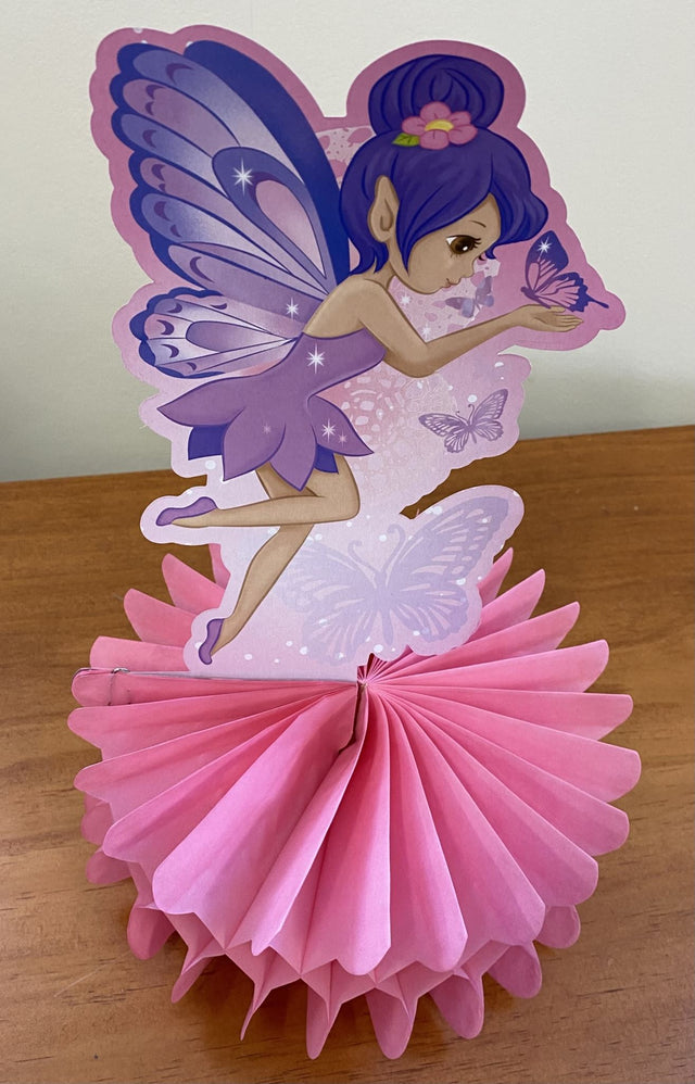 Whimsical pastel honeycomb centerpiece featuring a fairy princess design, perfect for enchanting parties and celebrations.