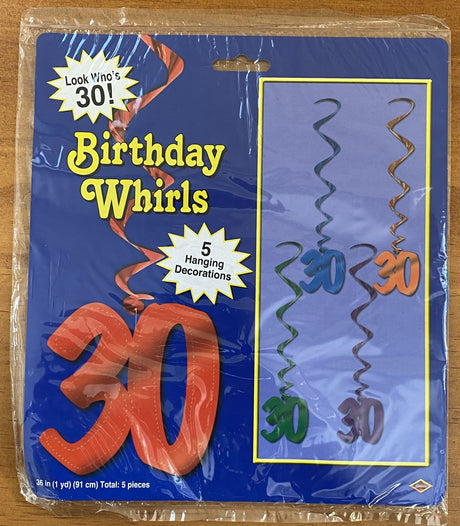 Colorful swirl decorations for a stylish 30th birthday celebration, perfect for indoor and outdoor party setups.