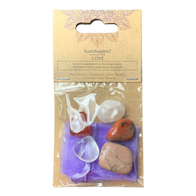 Love Wellness Crystal Kit featuring Red Jasper, Rhodonite, and Rose Quartz for emotional balance and self-love, in an elegant bag.