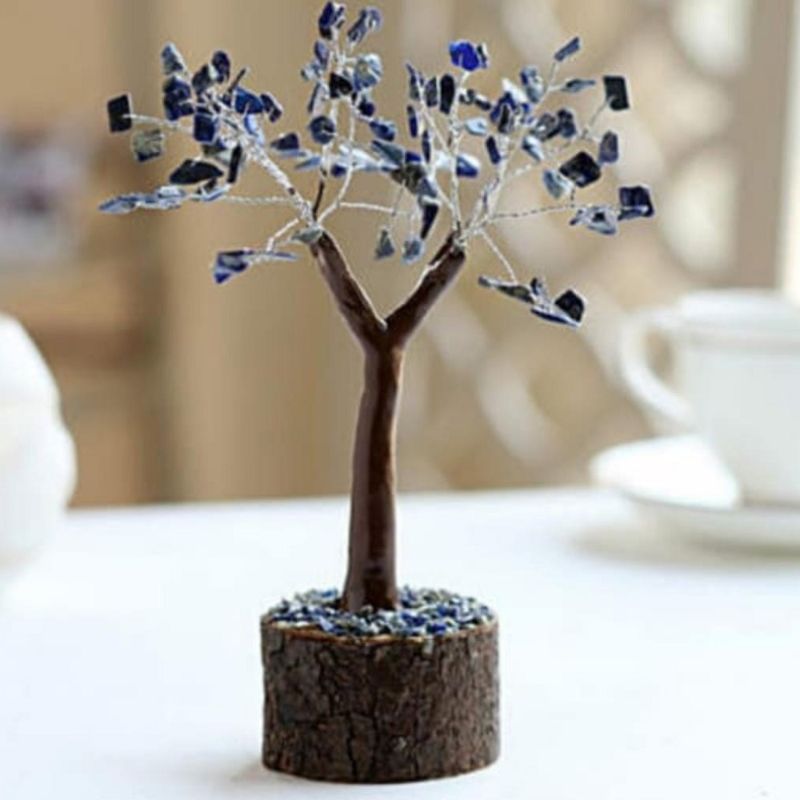 Handcrafted Lapis Lazuli crystal tree on a neem base, 19cm tall, featuring 100 vibrant gemstone chips for decor and spirituality.