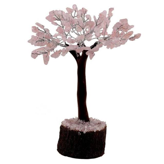 Rose Quartz crystal tree with 100 gemstone chips on a natural neem base, promoting love and tranquility, 19 cm tall.