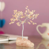 Handcrafted 19cm Rose Quartz Crystal Tree with 100 chip gemstones, promoting love and harmony in any space.