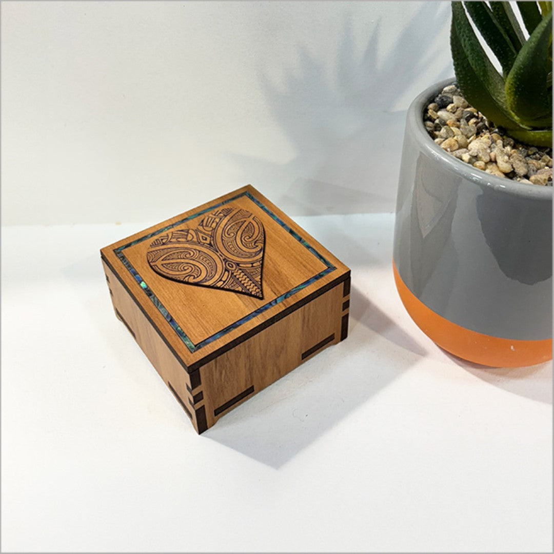 Charming small heart-shaped trinket box with Paua inlay, handcrafted from NZ veneer; ideal for jewelry or keepsakes.