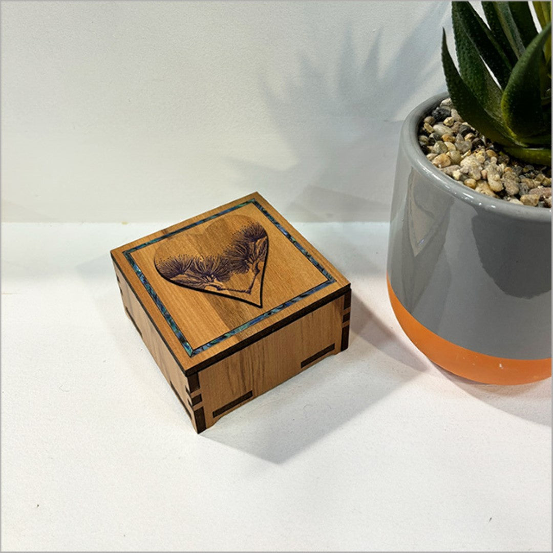 Small square trinket box with heart design, New Zealand veneer and paua inlay, perfect for jewelry and keepsakes.