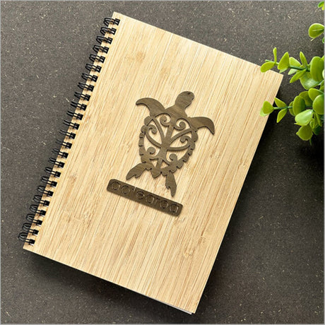 Bamboo journal with Turtle River Rimu motif, 160mm x 210mm, 110 pages for notes and sketches, showcasing eco-friendly design.