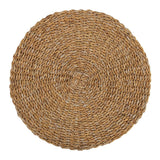 Handmade round seagrass placemat, 400mm, adds coastal charm and protects dining tables with eco-friendly style.
