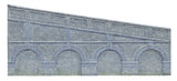 Engineers blue brick retaining walls for 00 gauge model trains, enhancing model railway scenery with authentic details.