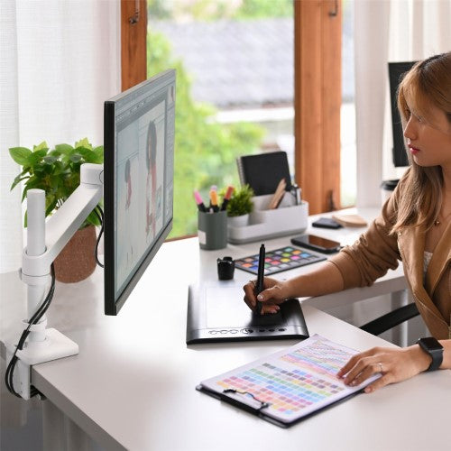 Ergotron NX Monitor Arm in white, supporting up to 34" monitors, offers ergonomic adjustments and sleek design for an organized workspace.