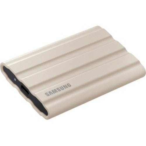 Portable Samsung T7 1TB SSD in Moonrock Beige, featuring 1050MB/s speeds, rugged IP65 durability, and 256-bit AES encryption.