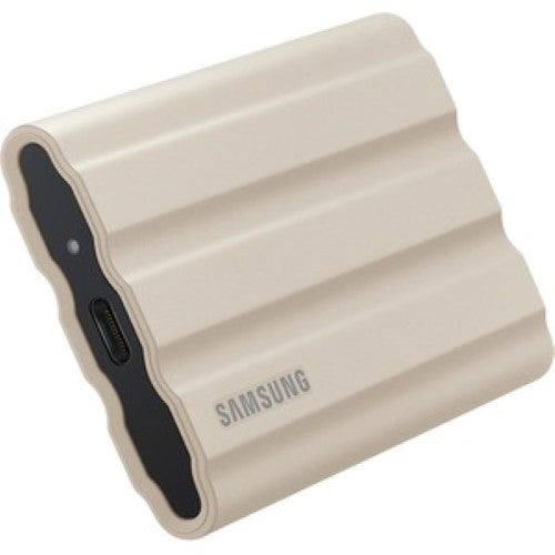 Portable Samsung T7 1TB SSD in Moonrock Beige, offering rugged durability, high-speed transfers, and AES encryption.