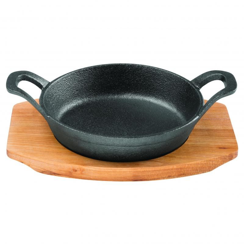 Pyrolux round gratin dish with tray, crafted from pre-seasoned cast iron for even cooking and rustic presentation.