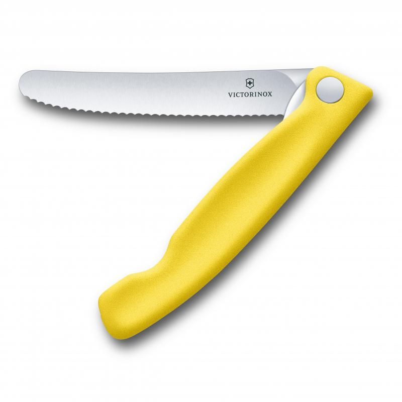 Vibrant yellow Victorinox Classic Folding Steak Knife with a sharp wavy edge for easy cutting of meats and vegetables.