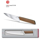 Victorinox Swiss Modern Carving Knife with 22cm walnut wood handle, designed for effortless slicing of meat, fruits, and vegetables.