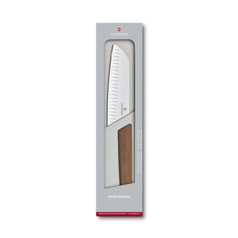 Victorinox Swiss Modern 17cm Santoku knife with fluted edge and walnut handle, ideal for versatile slicing in the kitchen.