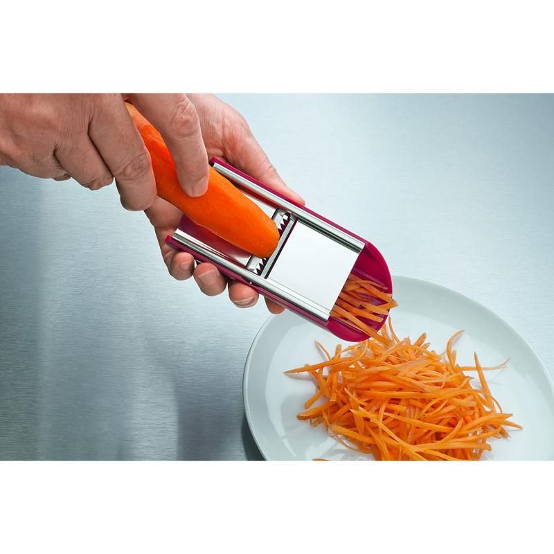 Victorinox Handslicer featuring a red ergonomic handle and three stainless steel attachments for slicing, julienne, and grating.