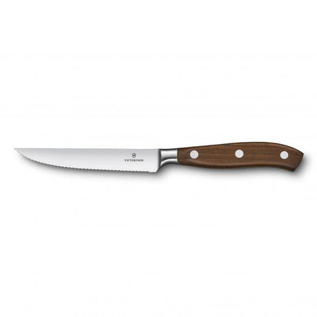 Elegant Victorinox 12cm steak knife with a wooden handle, designed for effortless slicing and comfort during meals.