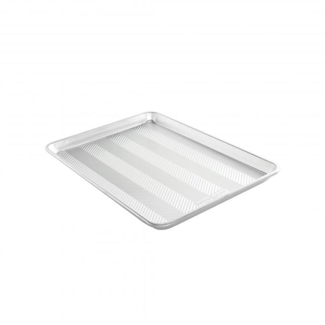 Nordic Ware Prism Half Sheet: embossed aluminum baking pan with a unique grid for even heat distribution and easy release.