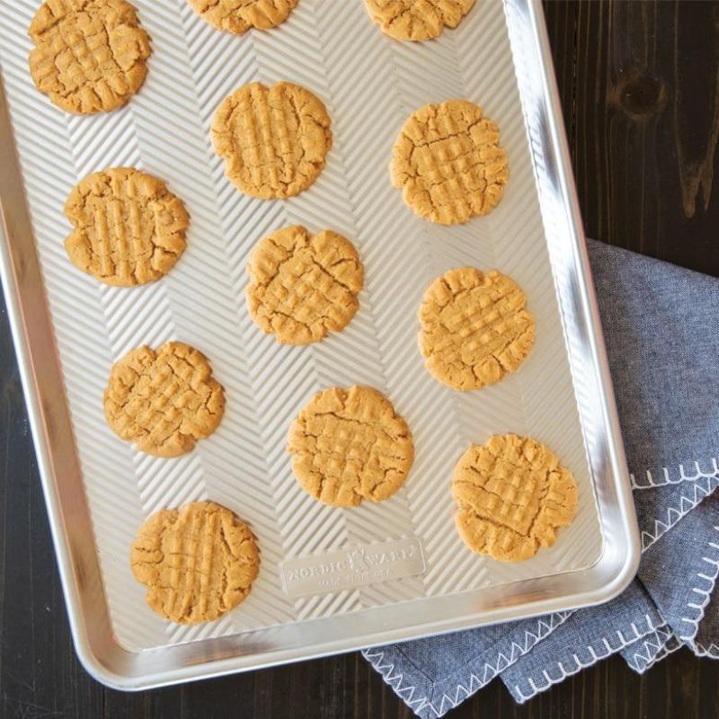 Nordic Ware Prism Half Sheet pan featuring an embossed aluminum design, perfect for even baking and easy release.