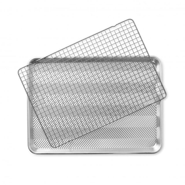 Nordic Ware Prism Half Sheet with nonstick grid, featuring durable aluminum, promotes even baking and easy food release.