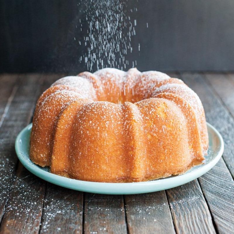 Nordic Ware 6 Cup Formed Bundt Pan in red, ideal for baking beautifully formed cakes with even heat distribution.